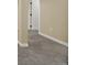 Close up of finished basement with neutral carpet and white trim at 1980 S Kearney Way, Denver, CO 80224