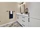 Updated bathroom features modern vanity, marble-style floors, and ample storage at 1980 S Kearney Way, Denver, CO 80224