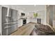 Updated kitchen with white cabinets, stainless steel appliances, and abundant counter space at 1980 S Kearney Way, Denver, CO 80224