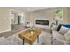 Cozy living room with a fireplace, modern furnishings, and open layout at 1980 S Kearney Way, Denver, CO 80224