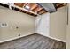 Basement utility room with vinyl plank flooring, modern hookups, and ample storage at 1980 S Kearney Way, Denver, CO 80224