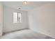 Comfortable bedroom featuring plush carpeting and a sunlit window with neutral paint at 3127 S Russell St, Morrison, CO 80465