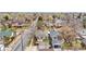 Aerial view displays neighborhood homes, tree-lined streets, and community layout at 1295 Elm St, Denver, CO 80220