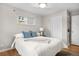 Inviting bedroom with a large window, a comfortable bed, and plenty of natural light at 1295 Elm St, Denver, CO 80220