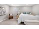 Cozy bedroom with neutral tones, plush carpet, and comfortable furnishings at 1295 Elm St, Denver, CO 80220