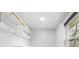 Spacious walk-in closet with shelving units for ample storage and a window at 1295 Elm St, Denver, CO 80220
