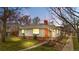 Charming single-Gathering home with brick accents, well-maintained lawn, and inviting curb appeal at dusk at 1295 Elm St, Denver, CO 80220