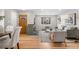 Open-concept living room with fireplace, stylish furnishings, and natural light at 1295 Elm St, Denver, CO 80220
