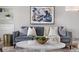 Living room featuring a modern gray sofa, marble coffee table, and stylish decor at 1295 Elm St, Denver, CO 80220