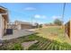 Expansive backyard featuring a detached garage, a concrete patio, and a grassy area, perfect for outdoor enjoyment at 391 N 7Th Ave, Brighton, CO 80601