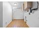 Finished basement with hardwood flooring, utility hookups, and overhead lighting at 391 N 7Th Ave, Brighton, CO 80601