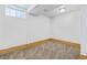 Bedroom featuring neutral carpet, a window, and wood trim at 391 N 7Th Ave, Brighton, CO 80601