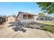 Well-maintained home featuring a spacious driveway and cozy covered front porch at 391 N 7Th Ave, Brighton, CO 80601