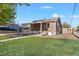 Quaint single-story home with a covered front porch and manicured lawn at 391 N 7Th Ave, Brighton, CO 80601