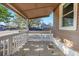 Covered front porch offers a welcoming space with ample room for seating at 391 N 7Th Ave, Brighton, CO 80601