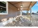 View of the covered front porch, featuring a secure entrance and classic design elements at 391 N 7Th Ave, Brighton, CO 80601