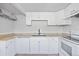 Bright kitchen featuring white cabinets, modern appliances, and stylish granite countertops at 391 N 7Th Ave, Brighton, CO 80601