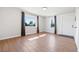 Bright living room featuring wood-look tile floors, natural light, and neutral decor at 391 N 7Th Ave, Brighton, CO 80601