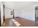 Bright and airy living room with wood-look tile flooring, perfect for relaxation at 391 N 7Th Ave, Brighton, CO 80601