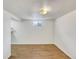 Finished basement with wood floors, white walls, window and shelving at 3118 S Joplin Ct, Aurora, CO 80013