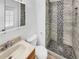 Modern bathroom featuring a tiled shower with a pebble floor and a updated vanity at 3118 S Joplin Ct, Aurora, CO 80013