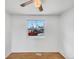 Bright bedroom with a ceiling fan, and a large window at 3118 S Joplin Ct, Aurora, CO 80013