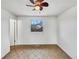 Bedroom with tile floors, a window offering natural light, and neutral walls at 3118 S Joplin Ct, Aurora, CO 80013