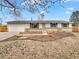 Charming single-story home featuring a well-maintained lawn and a two-car garage at 3118 S Joplin Ct, Aurora, CO 80013