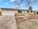 Charming single-story home featuring a well-maintained lawn and a two-car garage at 3118 S Joplin Ct, Aurora, CO 80013