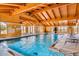 Indoor swimming pool and spa with high ceilings at 15551 Xanthia Ct, Thornton, CO 80602