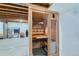 Basement sauna with glass door and wooden interior at 15551 Xanthia Ct, Thornton, CO 80602