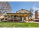 Spacious backyard with large patio area, grill, swing, and ample green space for outdoor activities at 2023 S Rifle St, Aurora, CO 80013