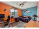 Bedroom featuring fan decor and a desk setup by the window for a fun, functional space at 2023 S Rifle St, Aurora, CO 80013