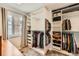 Walk-in closet with custom shelving and storage solutions near a window at 2023 S Rifle St, Aurora, CO 80013