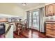 Cozy dining area with hardwood floors and access to an outdoor deck, perfect for entertaining at 2023 S Rifle St, Aurora, CO 80013