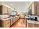 Long kitchen featuring stainless steel appliances, granite countertops, and lots of cabinet space at 2023 S Rifle St, Aurora, CO 80013
