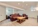 Basement featuring a cozy leather sofa and chair with carpeting and recessed lighting at 2023 S Rifle St, Aurora, CO 80013
