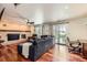 Bright living room with brick fireplace and access to the outdoor patio at 2023 S Rifle St, Aurora, CO 80013