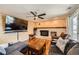 Inviting living room featuring a brick fireplace and wood paneling at 2023 S Rifle St, Aurora, CO 80013