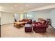 Basement featuring a cozy leather sofa and chair with carpeting and recessed lighting at 2023 S Rifle St, Aurora, CO 80013