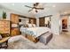 Bright main bedroom featuring a large bed and unique rustic barn door at 2023 S Rifle St, Aurora, CO 80013