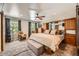 Spacious main bedroom with cozy carpet and large windows offering natural light at 2023 S Rifle St, Aurora, CO 80013