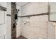 Designer shower featuring dual shower heads, custom tiling, and a pebble floor at 2023 S Rifle St, Aurora, CO 80013