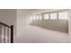 Large finished basement with recessed lighting, big windows and carpet flooring at 11491 Alla Breve Cir, Lone Tree, CO 80134