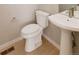 Powder room featuring modern fixtures and a pedestal sink at 11491 Alla Breve Cir, Lone Tree, CO 80134