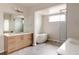 Spa bathroom with soaking tub, large glass shower, and dual vanities at 11491 Alla Breve Cir, Lone Tree, CO 80134
