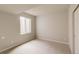 Bedroom featuring a large window, neutral carpet, and a closet at 11491 Alla Breve Cir, Lone Tree, CO 80134