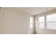 Bedroom with neutral carpet and walls, as well as large windows with plenty of natural light at 11491 Alla Breve Cir, Lone Tree, CO 80134