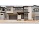 Modern two-story home boasting a multi-tone color scheme, attached garage, and inviting front entry at 11491 Alla Breve Cir, Lone Tree, CO 80134