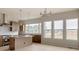 Kitchen with stainless steel appliances, an island, light countertops, and lots of natural light at 11491 Alla Breve Cir, Lone Tree, CO 80134